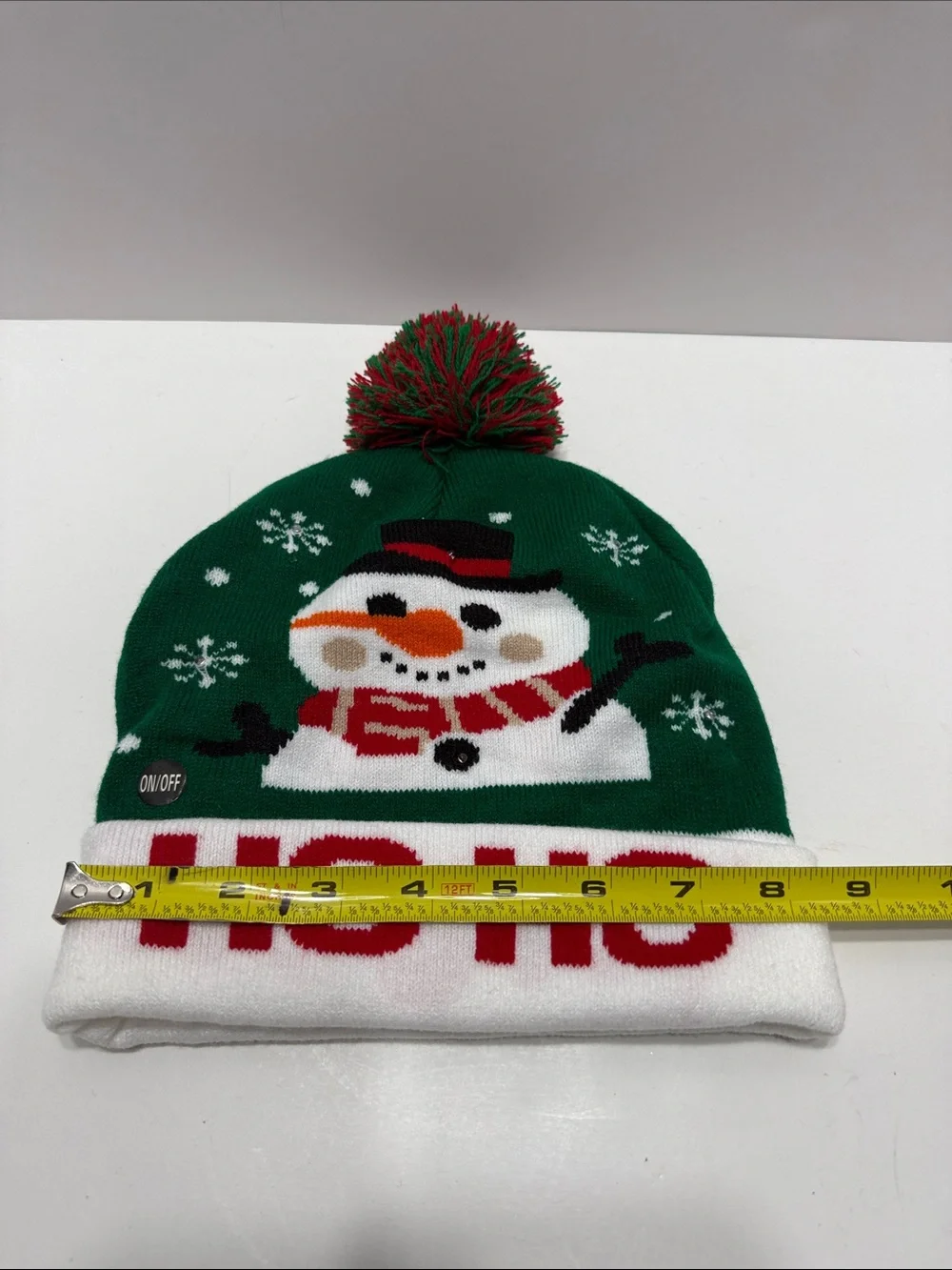 Green Holiday Light Up Snowman Pom-Pom Beanie Hat with 'HO HO' Cuff